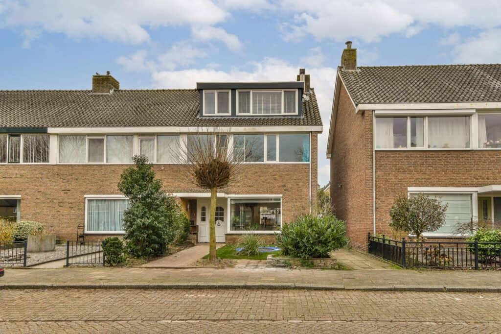 Row of brick houses with front yards