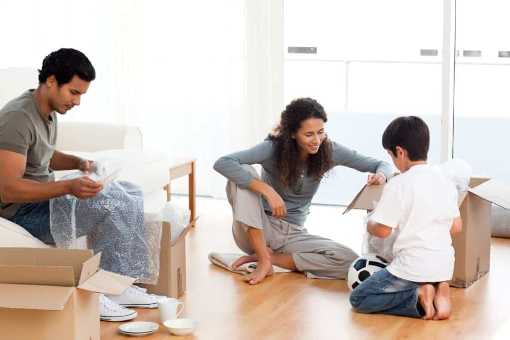 A small family packing the dishes