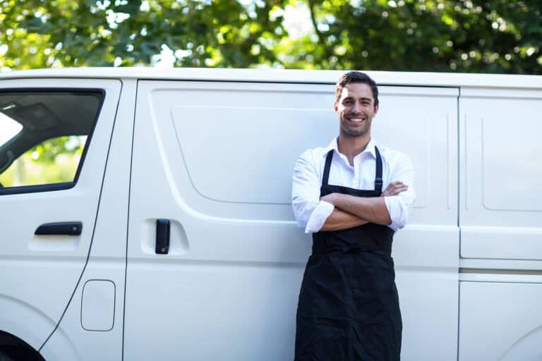 Man standing against white van