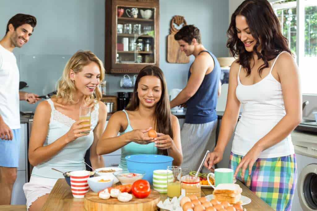 Flatmates cooking in the kitchen