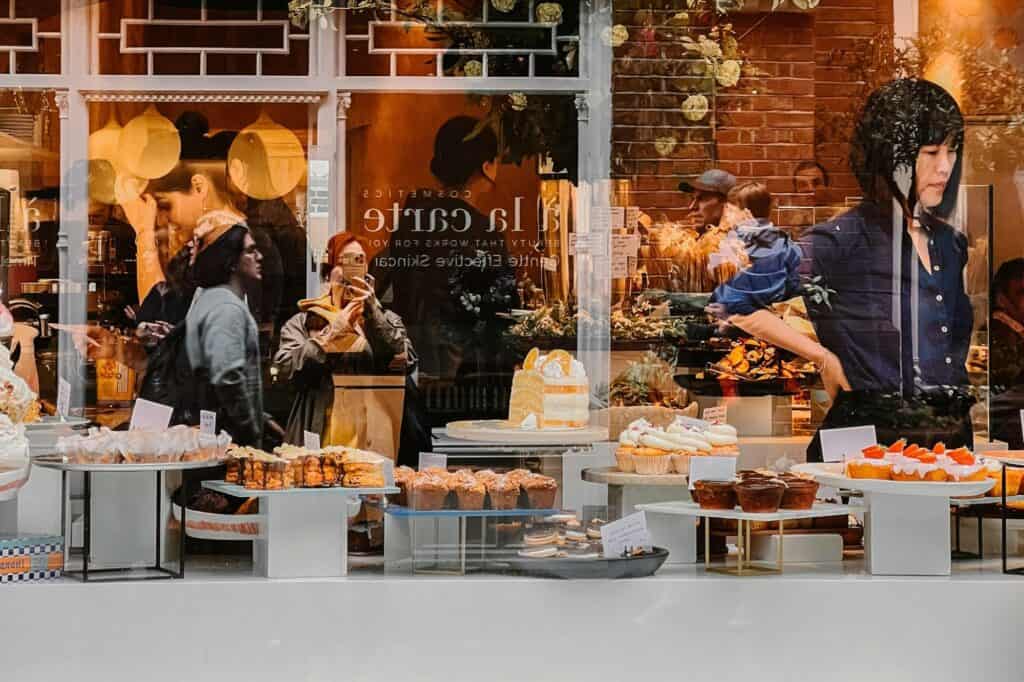 A large pastry shop with people inside