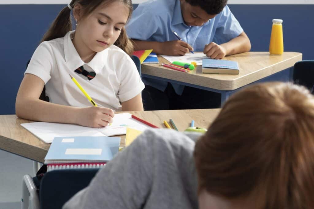 Cropped image of students working on classwork